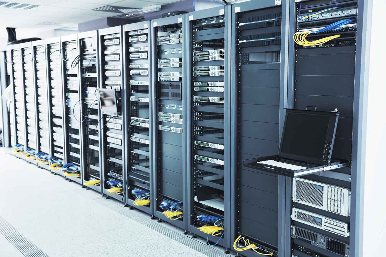 Image of server room with racks of servers cabled in a network enviroment